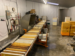Honey extracting room with 60 frame horizontal extractor